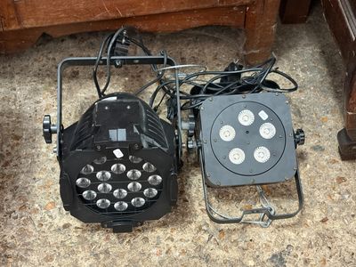 two lights that are sitting on the floor