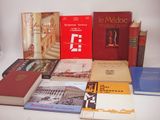 several books on a white table with a white background
