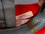 a close up of a pair of shoes with a tag on them