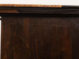 an image of a wooden dresser with a marble top