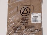 a bag of brown paper with a recycle logo on it