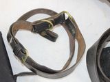 a belt and a cell phone on a table