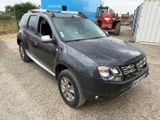 a picture of a dust covered dacia parked in a parking lot