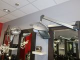 a picture of a hair dryer and a mirror in a room