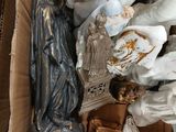 a box full of religious figurines and other religious items