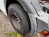a truck that has a flat bed on the back of it