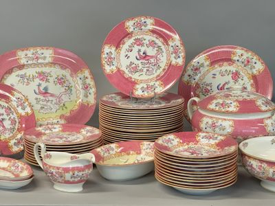 many different types of plates and bowls on the table
