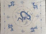 an image of a blue and white table cloth with a dragon on it