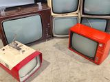 four televisions that are sitting on the floor