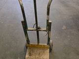 a small hand truck that is sitting in a warehouse