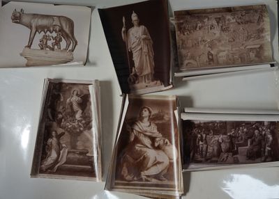many old photos of people and animals on the table