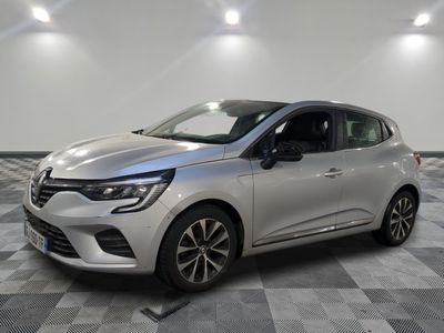 a silver car parked in a room with a checkered floor