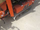 a small machine that is parked on the side of the road