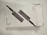 two toothbrushes sitting on top of a box of toothpaste