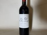 a bottle of wine that is sitting on a table