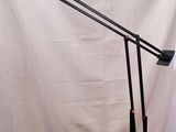 an image of a desk lamp on a wooden table with a white background