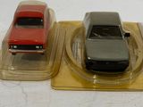 three toy cars that are sitting on top of each other