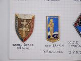 several badges are shown on a piece of paper on a table
