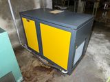 a yellow and black machine in a room