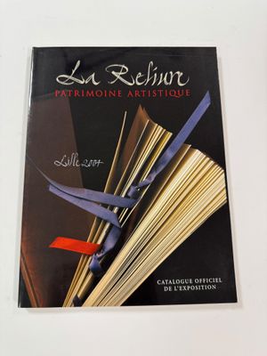 the cover of a book with scissors on top of it