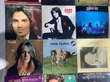 a picture of a collage of various albums on a table