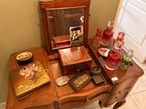 a small table with a mirror and a mirror on it