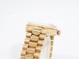 an image of a close up of a wrist watch on a white surface