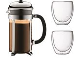 un gros plan sur une cafetière et deux tasses de café