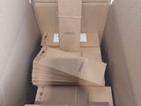 une boîte en carton remplie de boîtes et de papiers