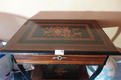 a small wooden table with a drawer on top of it