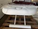 an image of a bed on a pallet in a garage