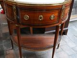 a small table with a marble top on it