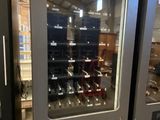two vending machines that are on display in a store