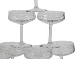 a stack of wine glasses sitting on top of each other