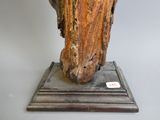 a statue of a bird that is sitting on top of a base