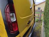 a yellow van that is parked on the side of the road
