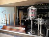 an image of a bar with a beer dispenser on the counter