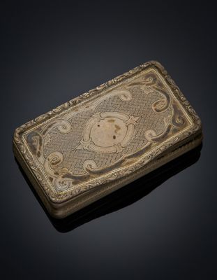 an old silver box with a picture of a monkey on it