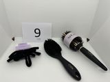 a close up of a hair brush and glove on a table