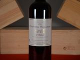 a bottle of wine that is sitting on a table