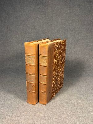 an image of two old books sitting on top of each other