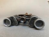 a pair of binoculars that are sitting on a table