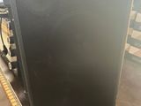 a close up of a speaker sitting on top of a table