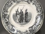 two black and white plates with a picture of a man and a woman on them