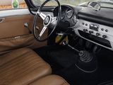 a view of the inside of a car with leather seats