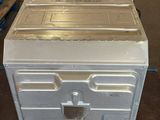a white refrigerator sitting on a cart in a room