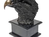 a close up of a statue of an eagle on a pedestal