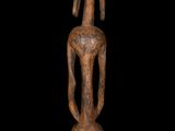 an image of a wooden sculpture of a woman on a black background