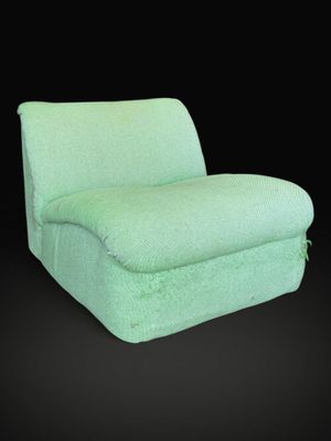 an image of a green chair on a black background