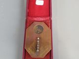 a key in a red box on a table